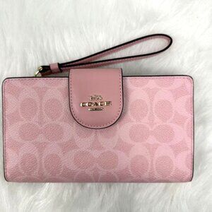 Coach Phone Wallet Wristlet In Signature Canvas In Powder Pink